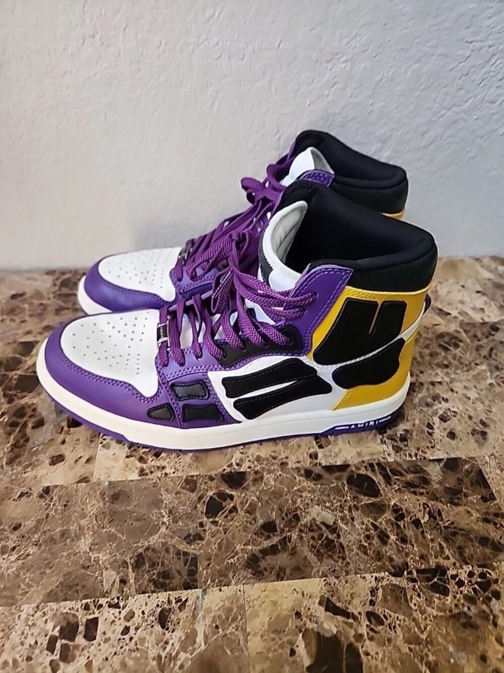 Amiri Skel purple yellow black, and white high tops with charm. Size 7 sneakers